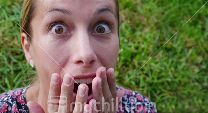 Young woman showing excitement and disbelief
