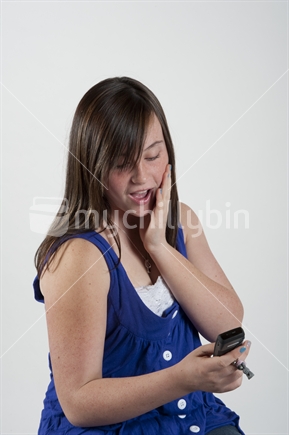 13 year old teenage girl texting on cell phone