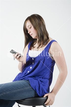 13 year old girl texting on cell phone