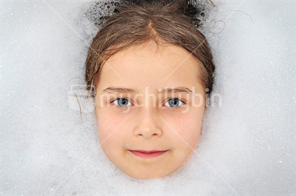 Girl in a warm bubble bath