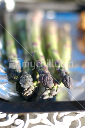 Asparagus on a tray with foil