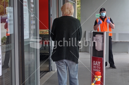 GREYMOUTH, NEW ZEALAND, APRIL 11, 2020: Supermarket staff greet a customer during the Covid 19 lockdown in New Zealand, April 11,  2020