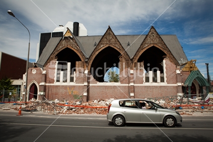 Christchurch brick and lath Church building damaged in the earthquake 2011, clearance markings, vehivle, and rubble. 