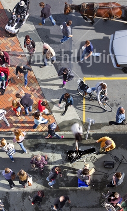 Busker entertains shoppers at Nelson's iconic Saturday markets - aerial view (motion blur) 