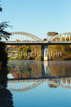 The iconic Fairfield bridge reflected in the Waikato river