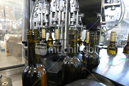 Wine being bottled in a vinyard processing plant