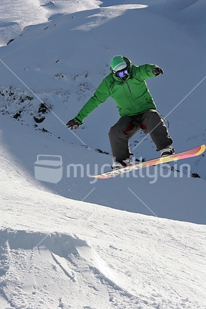Snowboarder mid jump