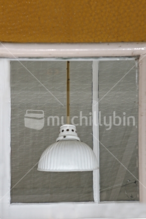 White lampshade with yellow cord and matching yellow edge