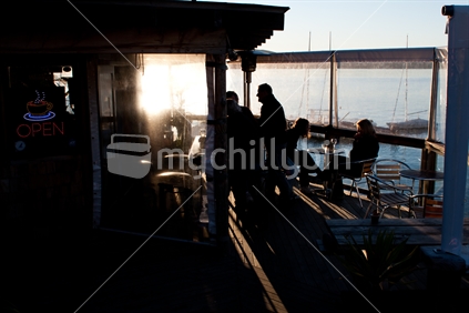 Wharf cafe open, at sunset in New Zealand. 