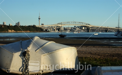 Boat at Little Shoal Bay with AKL  Harbour Bridge (focus) in the background