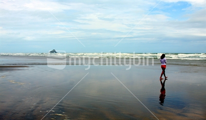 Girl walking on Ninety Mile Beach