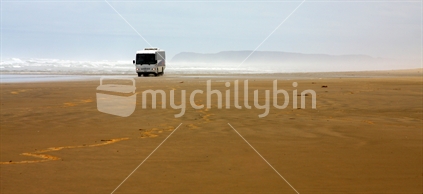 Coach driving down 90 Mile Beach