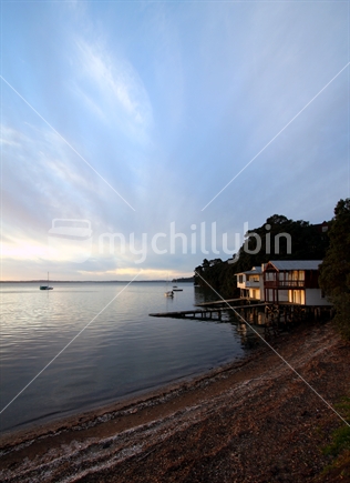 Boat house at Coxs Bay illuminated by evening sun