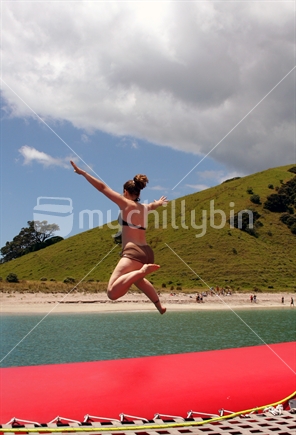 Girl jumping of boat