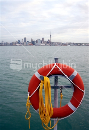 Life buoy in front of Auckland skyline