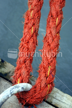 Red rope tied to bollard