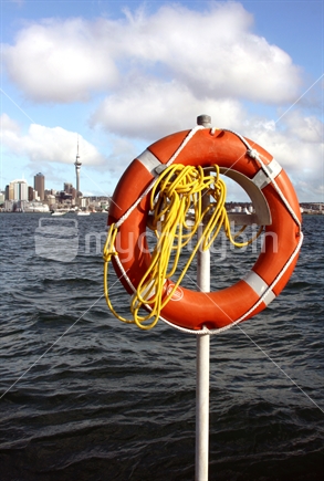 Life buoy in front  of Auckland's Skyline