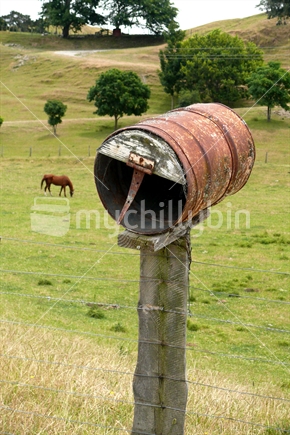 Drum letterbox with horse in background