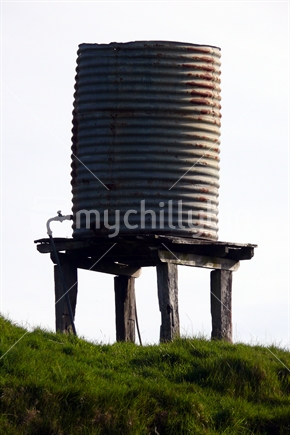 Water tank on farm hillside, New Zealand
