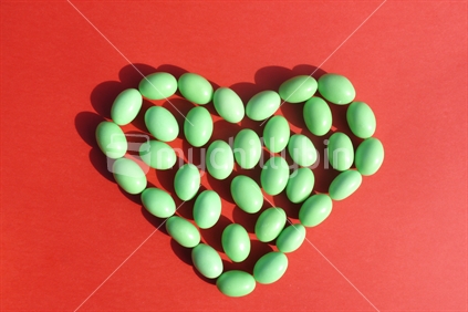 Snifters, the old iconic New Zealand lollies in heart shape on red background