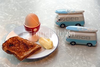 Egg, toast and butter; with retro combi van salt and pepper shakers.
