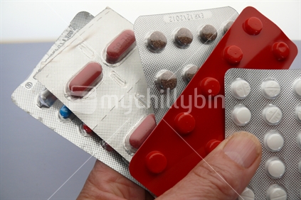 Pharmaceutical packs of prescription pills.