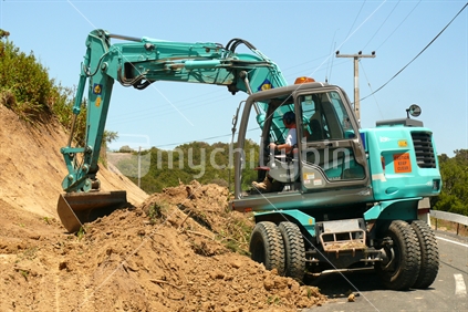 Digger widening the road