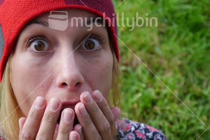 Surprised woman wearing beany
