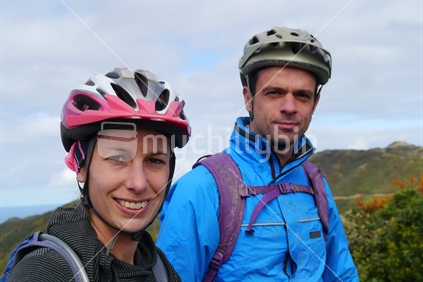 A young couple ready to go mountain biking