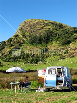 Retro campervan at Spirit's Bay, Northland (focus hill)