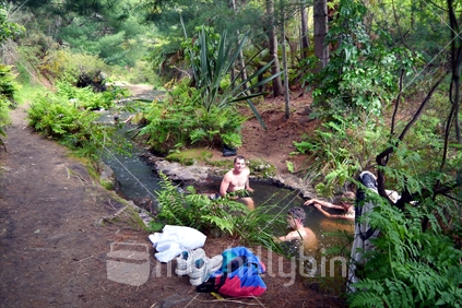 Tourists enjoying bathing in natural hot spring stream, Kerosene Creek