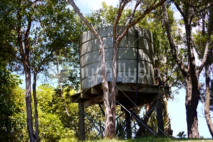 Water tank amongst the trees