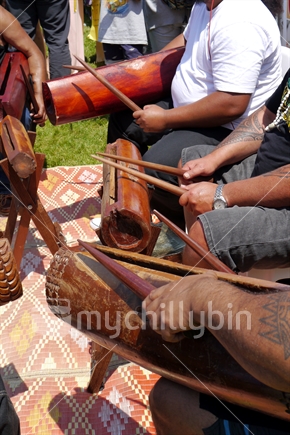 Tongan men playing slit drums at Pacifika Festival