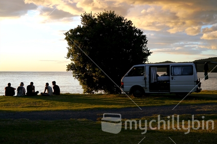 Five men with their campervan in the evening (see also #100093_3066, #100093_3129, #100093_3056) 