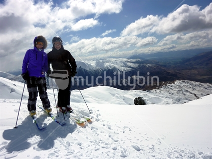 Older man and woman skiing