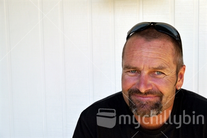 Middle aged man smiling and looking directly at the camera (see also 100093_3336)