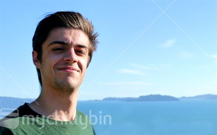 Teenage boy with coastal background