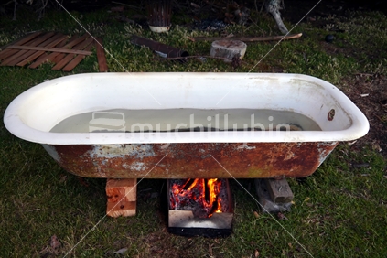 Cast iron bath with open fire to heat