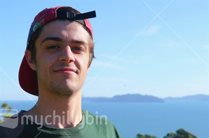 Teenage boy with cap on backwards