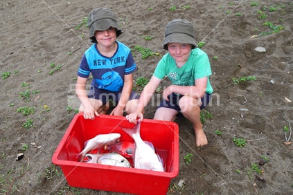 Proud boys with their catch of fish
