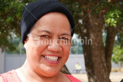 A smiling Pacific Islander