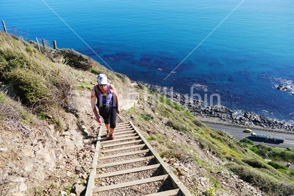 Woman climbing steps on the Te Araroa Trail