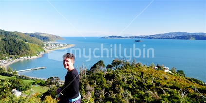 Woman with Days Bay, Wellington in the background