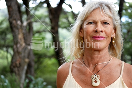 Close up of woman wearing a bone carved necklace