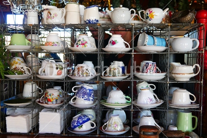 Display of colourful china tea cups