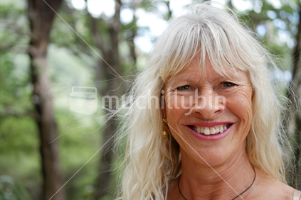 Radiant aging woman in native bush