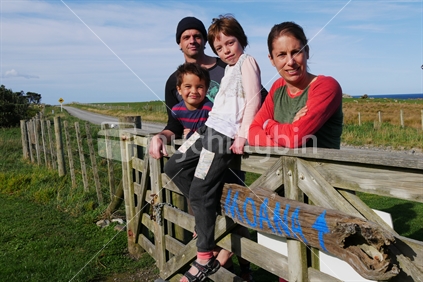 Family of four by the sea