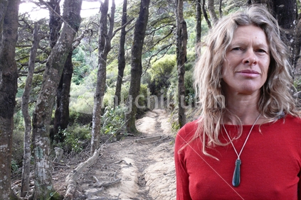 Woman wearing pounamu on bush track