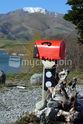 Letterbox on shores of lake in Canterbury, New Zealand