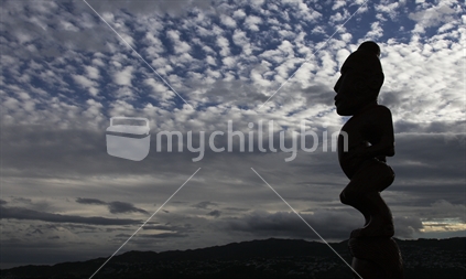A silhouette of a Maori carving on Mt Victoria in Wellington, New Zealand